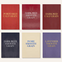 Multiple faux leather menu covers in red, ivory, dark blue, and lavender