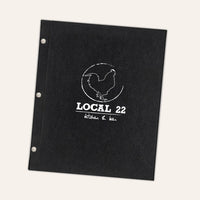 Black faux leather menu cover with white printed logo