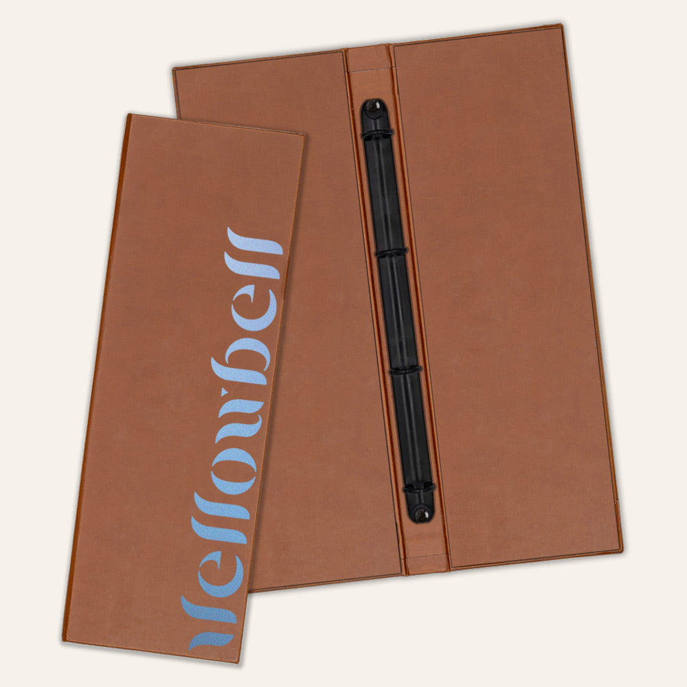 Brown faux leather menu cover with a centered clip