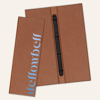 Brown faux leather menu cover with a centered clip