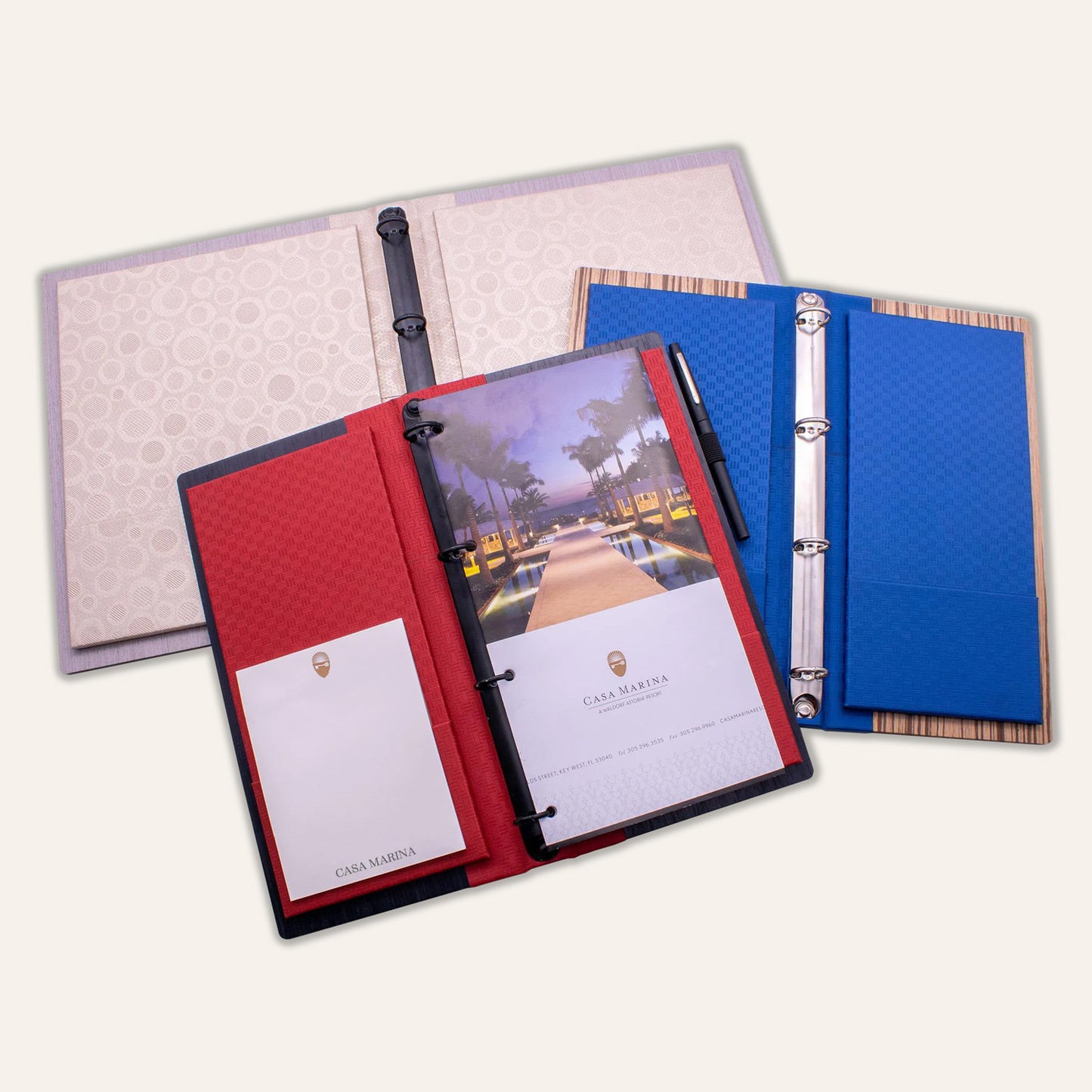 Wood hotel directories with binder rings and pen loop
